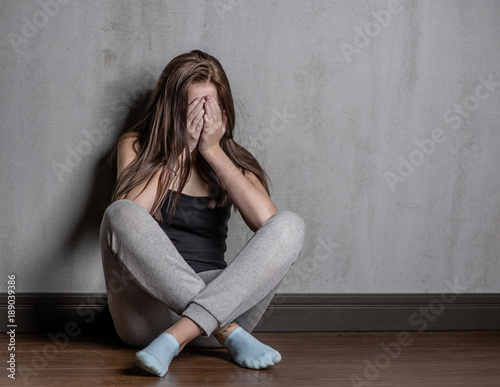 depression teen girl sit on the floor © Ermolaev Alexandr