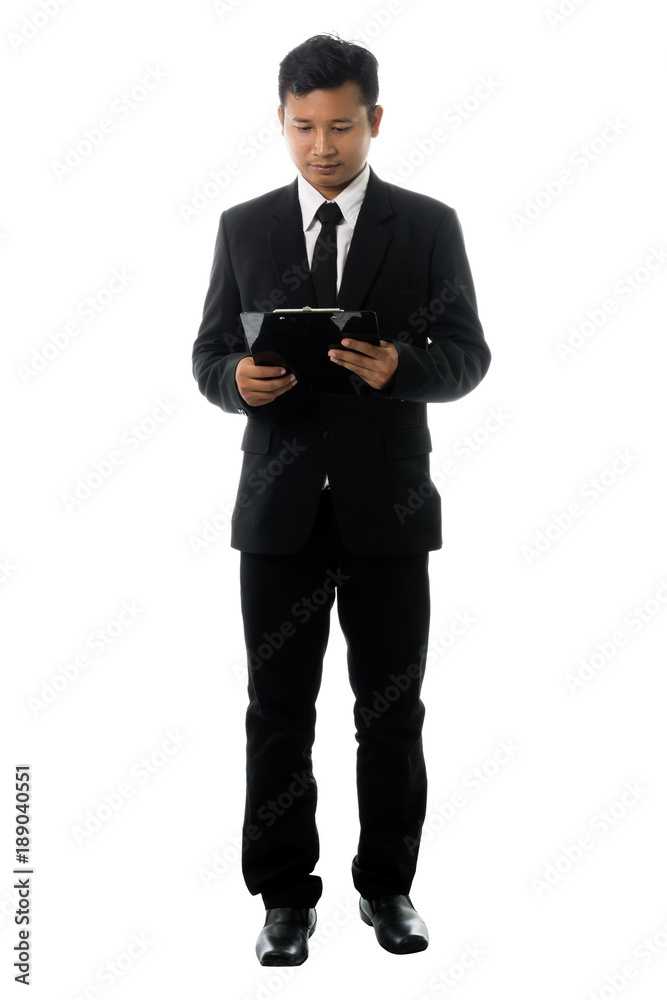 Portrait of a young business man with annual report. Isolated on white background Portrait of a young business man with annual report. Isolated on white background
