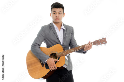 Portrait of a young asian businessman with guitar. Isolated on white background