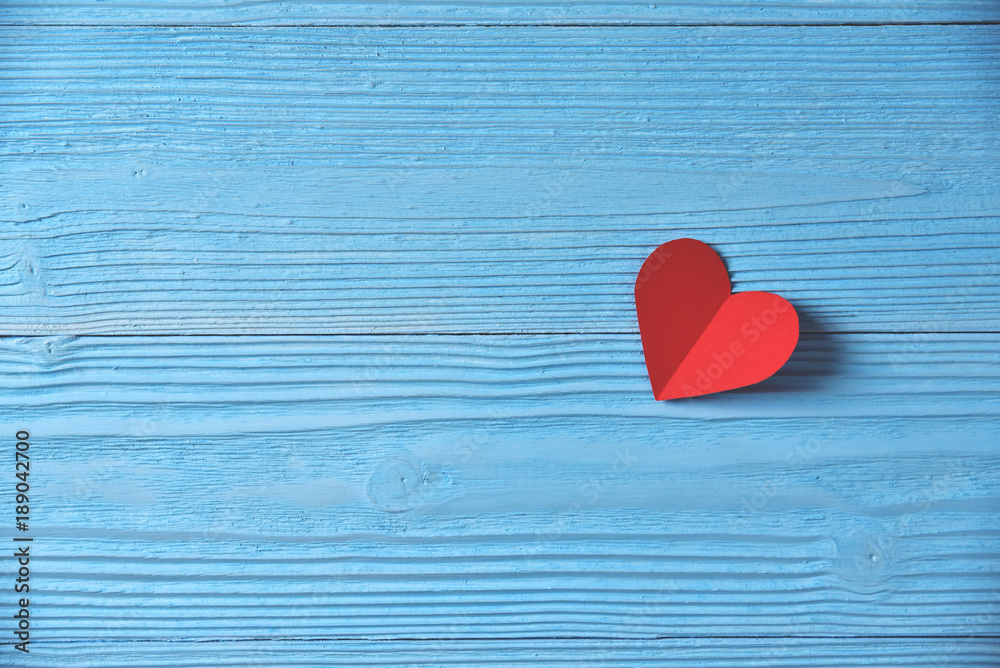 Red heart on blue wooden background. Red heart on blue wooden background.