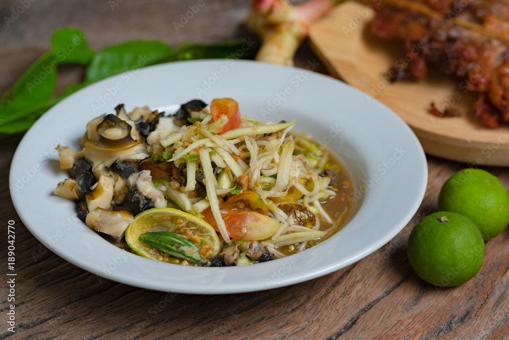 papaya salad. Traditional spicy Thai food.
papaya salad. Traditional spicy Thai food.