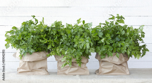 Fresh parsley from the garden. Bunches of parsley in paper bags. Farmers market