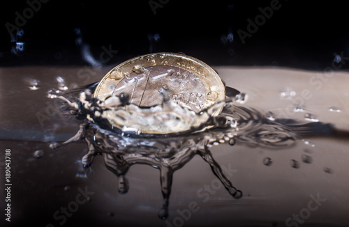 Euro Coin splashing in a bucket photo