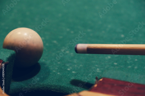 Billiard stick cue ready to shot ball close up photo