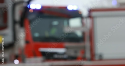 Firefighter or fireman fiting with fire on home.