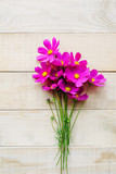 top view of bouquet of cosmos flower on wooden table