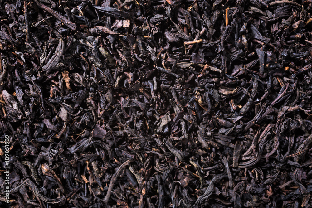 Background with black tea with copy space. Top view.