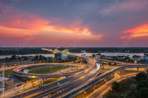 Long exposure light road on expressway with beautiful sunset, Nonthaburi bridge, Thailand