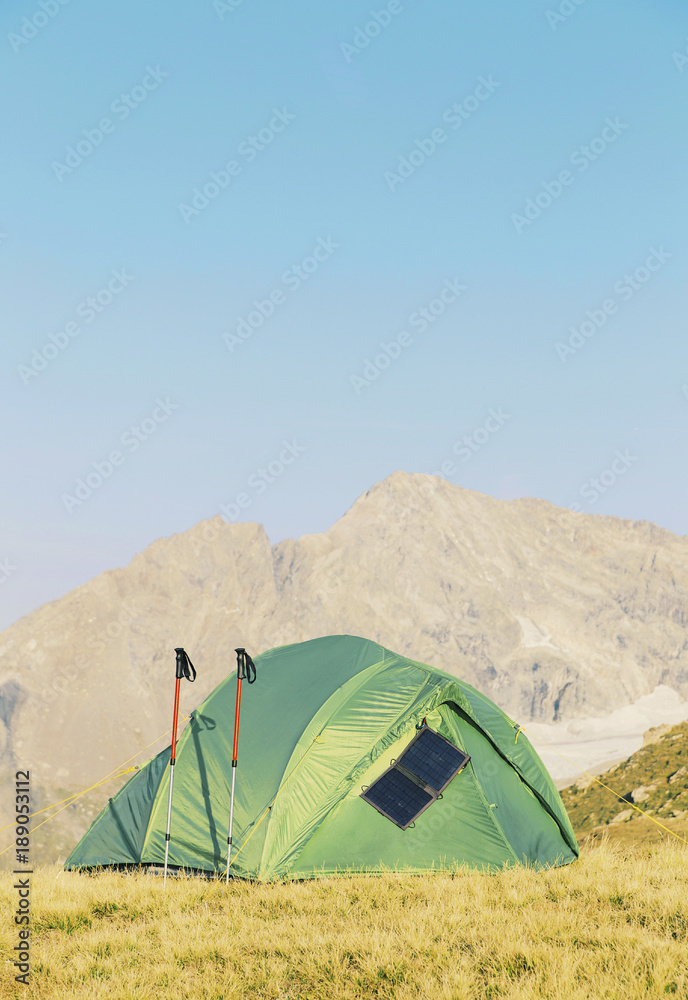 Tent standing on a mountain top.