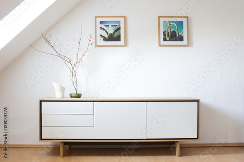 Modern sideboard in bright living room photo