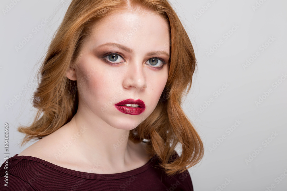 Mistrust and puzzled redhead woman, looking at camera, expressive face. Mistrust and puzzled redhead woman, looking at camera, expressive face.