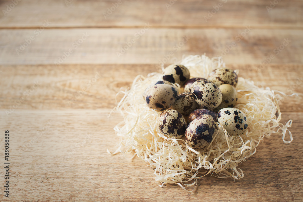 Eggs in nest on wooden texture easter theme, rustic
