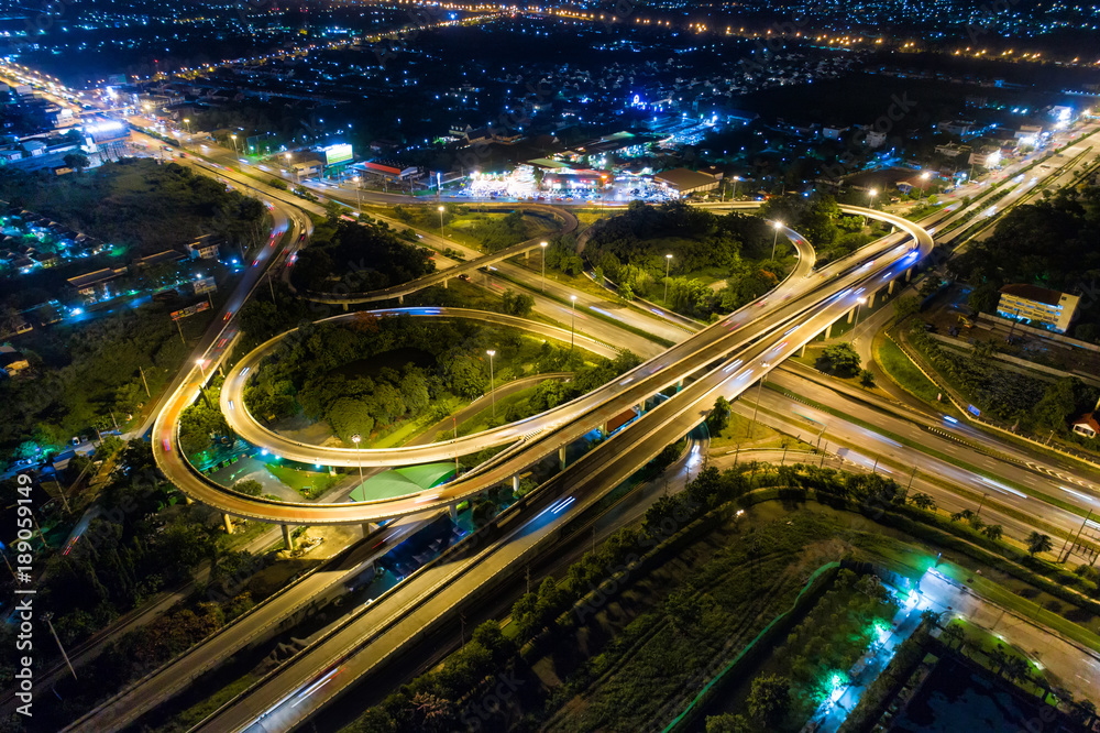 The light on the road roundabout at night and the city in Bangkok, Road beautiful Aerial View of Busy Intersection, Aerial view. Top view. Background scenic road. The light on the road roundabout at night and the city in Bangkok, Road beautiful Aerial View of Busy Intersection, Aerial view. Top view. Background scenic road.