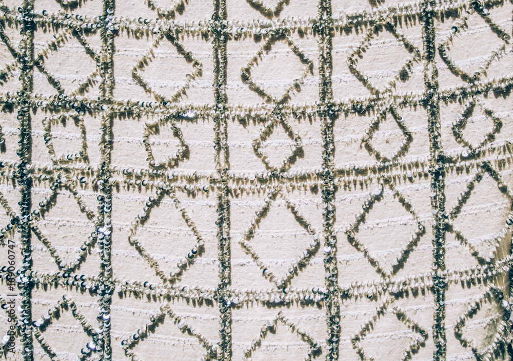 Closeup of Moroccan grey tapestry with sequins