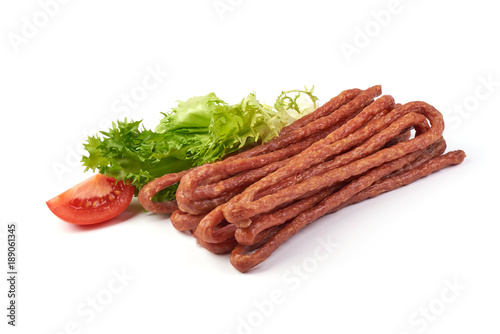Kabanos. Polish long thin dry sausage made of pork. Isolated on white background.