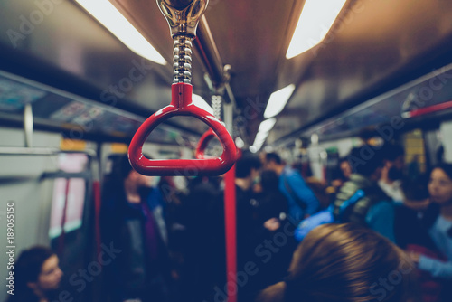 Photography People were traveling By holding the handrails on the subway in Hong Kong