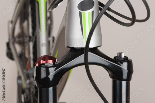 Suspension bicycle fork, close up view, studio photo