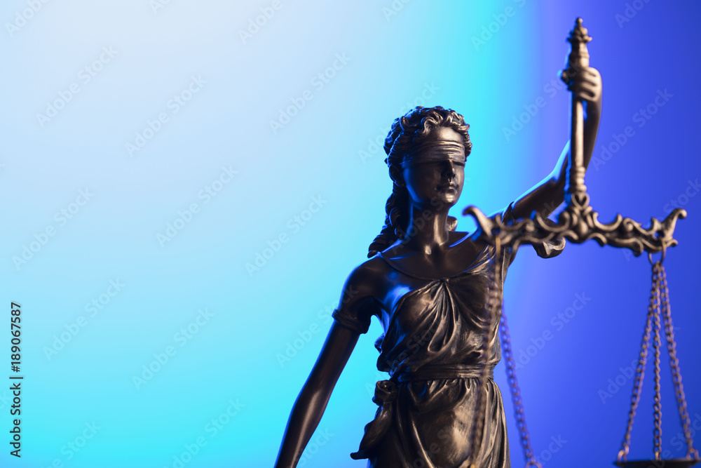 Fototapeta premium Gavel and themis on blue background.