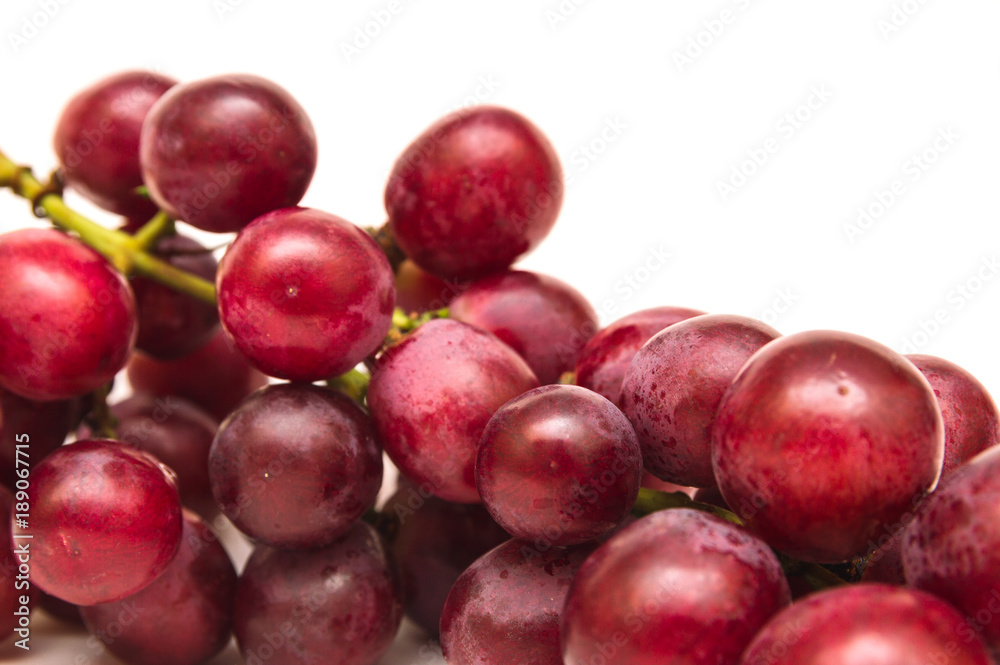 Fresh red grapes isolated on white background Fresh red grapes isolated on white background