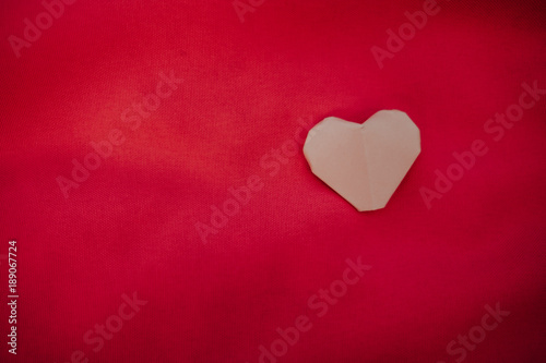 pink heart placed on red background. image for valentine day  idea  love  celebration  copy space  decoration concept