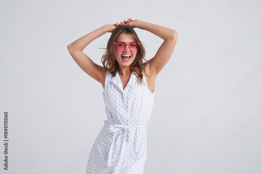 Pretty woman in pink sunglasses having fun while posing Pretty woman in pink sunglasses having fun while posing