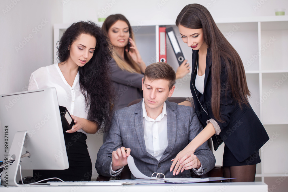 Fototapeta premium Young creative managers team working with new startup project in modern office.