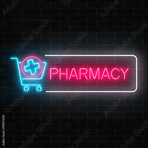 Neon pharmacy glowing signboard with medical cross in shopping cart on brick wall background.