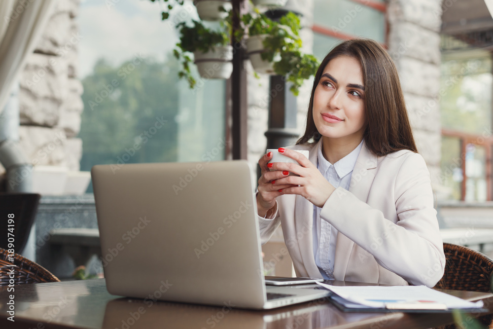 Young businesswoman outdoors working with laptop Young businesswoman outdoors working with laptop