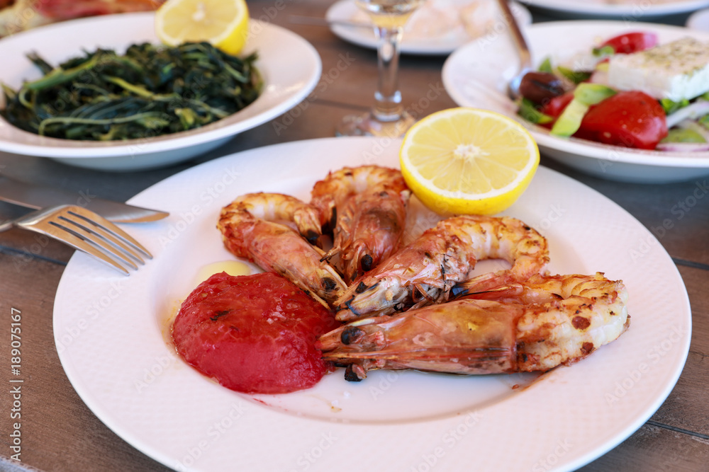 Shrimps cooked on grill in the greek tavern. Shrimps cooked on grill in the greek tavern.