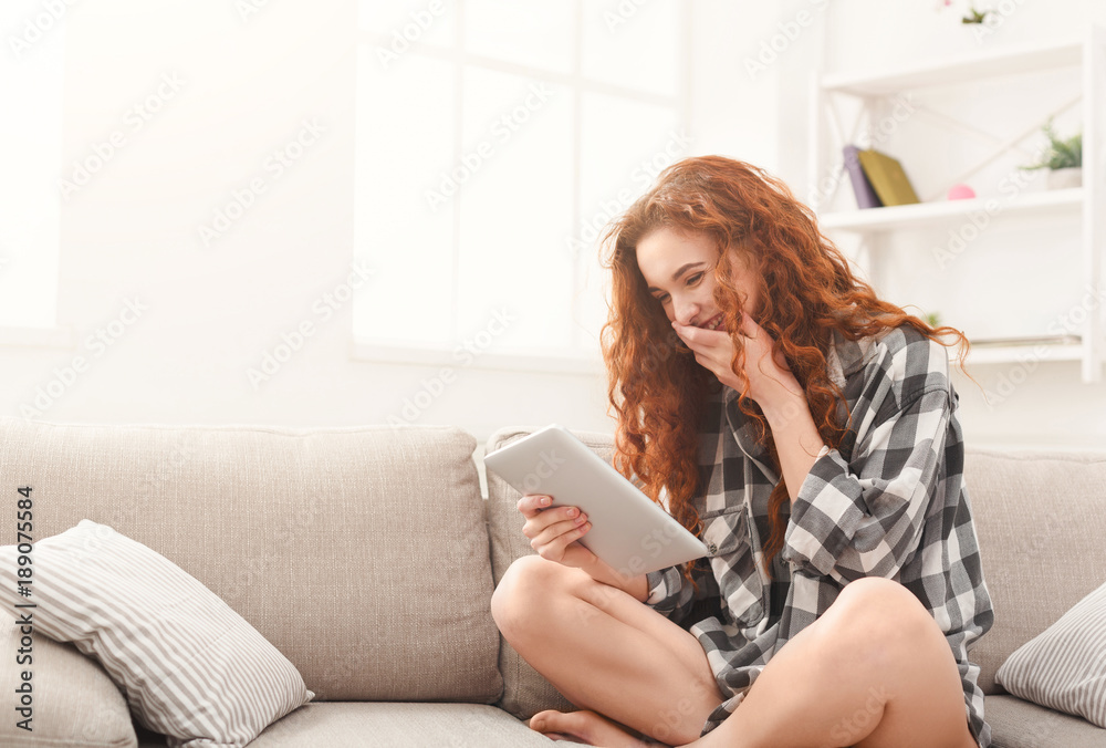Happy girl with digital tablet at home Happy girl with digital tablet at home