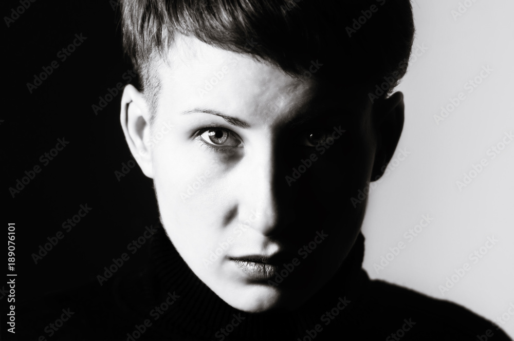 Black and white portrait of a girl with a serious gaze. Black and white portrait of a girl with a serious gaze.