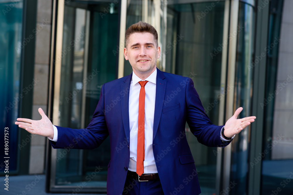 Businessman smiling and welcoming you.