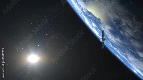 Flying satellite. The satellite appears in the frame and flies away. Satellite scan and monitor the Earth. The earth rotates slowly. 4K. photo