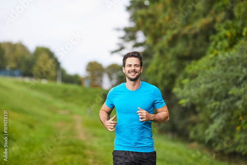 Portrait of young man running