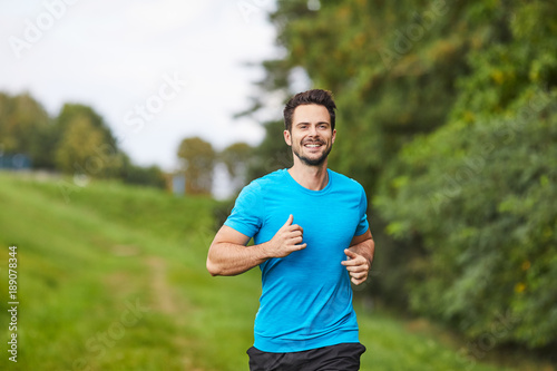 Portrait of handsome man running