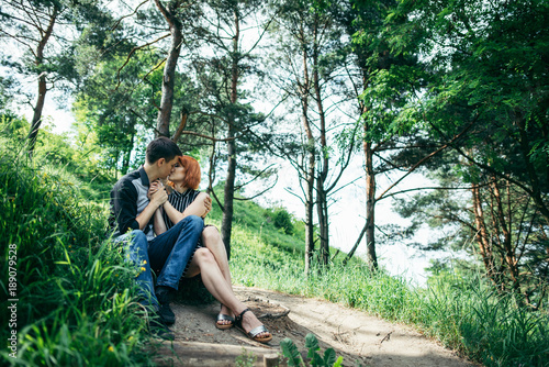 portrait of beautiful young pair in a park photo