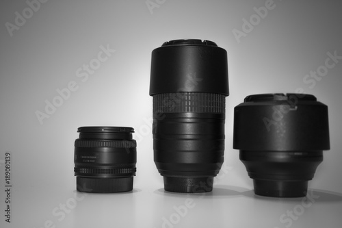 three black lens are on a white background they are different focal length