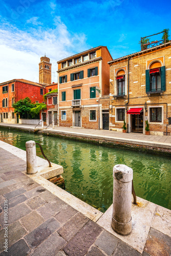 Venice cityscape, water canal, campanile church and traditional buildings. Italy