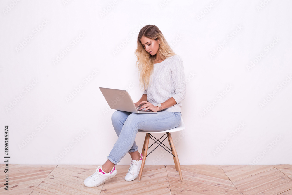 Girl is surfing through the Internet and looking for some intere Girl is surfing through the Internet and looking for some intere