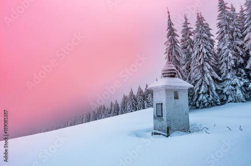 Fototapeta Naklejka Na Ścianę i Meble -  Remote chapel in winter in Beskidy mountains, Poland