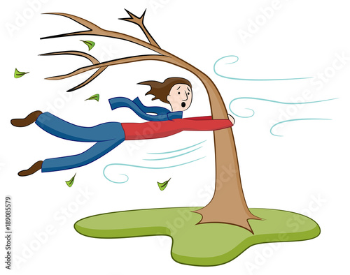 Man Holding On To Tree on Windy Day