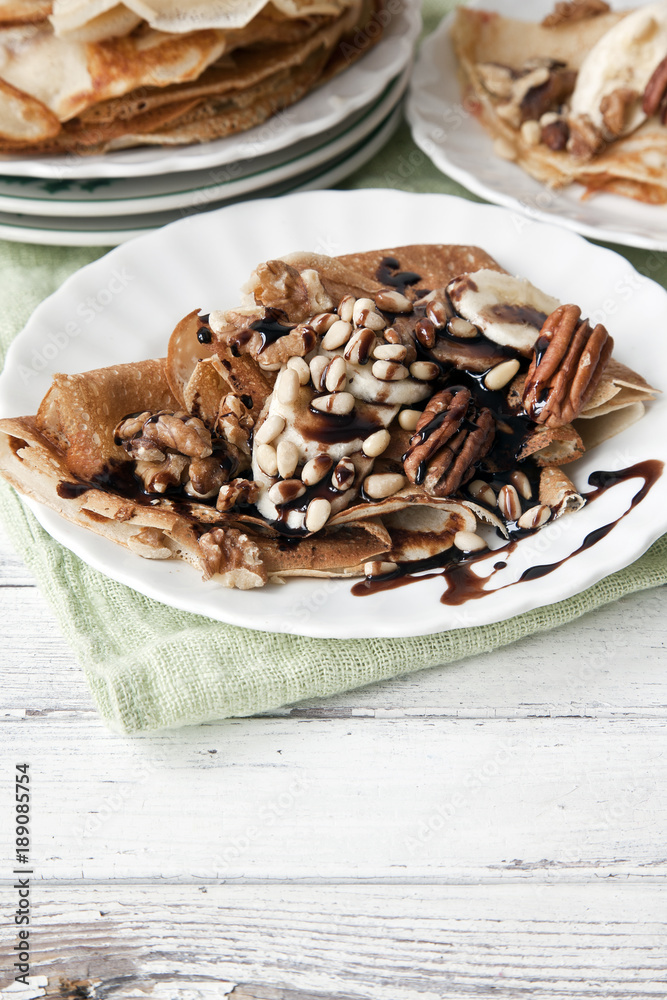 Traditional homemade pancakes. Celebration of Maslenitsa, Shrovetide. Close-up, selective focus. White vintage wooden background. Traditional homemade pancakes. Celebration of Maslenitsa, Shrovetide. Close-up, selective focus. White vintage wooden background.