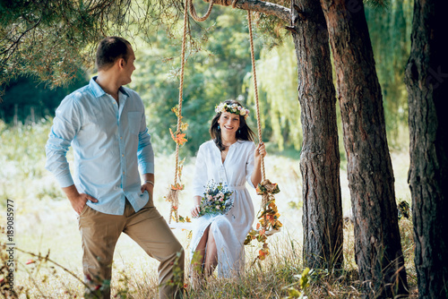 Young couple in love. A love story in the forest park.