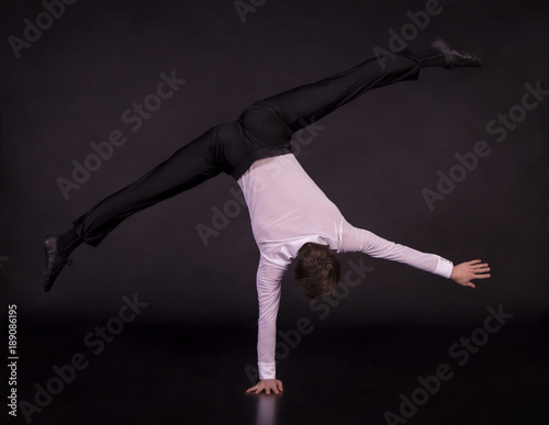 Fototapeta Naklejka Na Ścianę i Meble -  Extraordinary boy gymnast - yoga