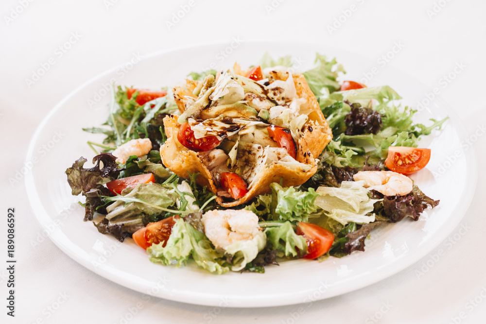 Fresh delicious salad with seafood and vegetables. Fresh delicious salad with seafood and vegetables.