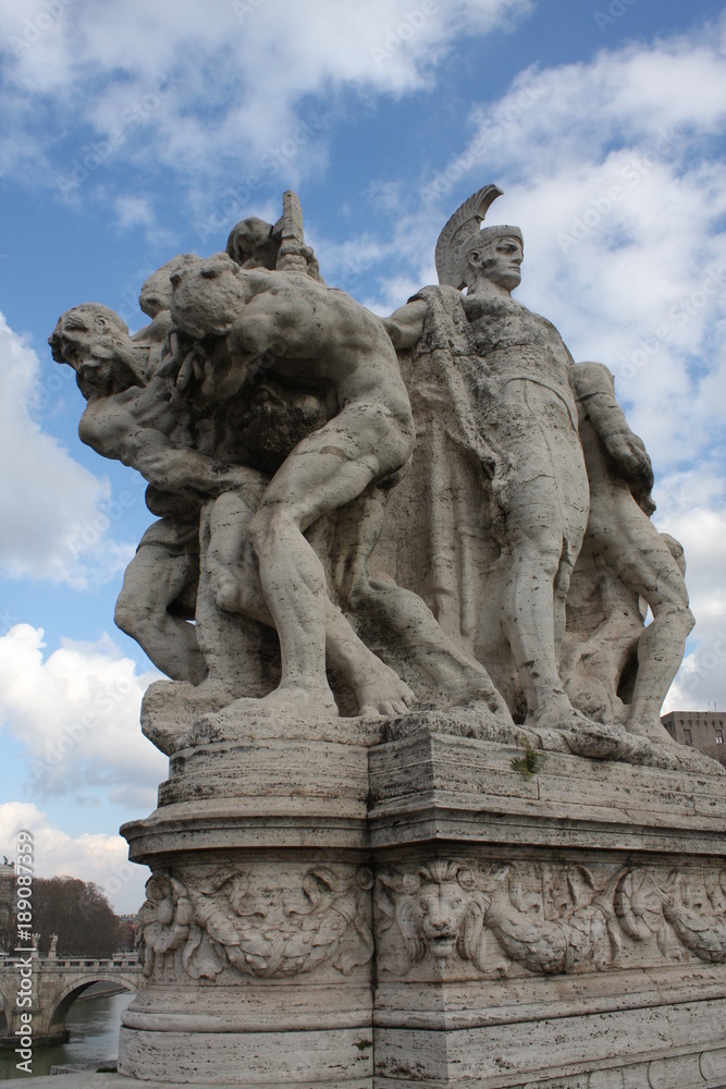 One of the statues at famous Ponte Vittorio Emanuele 2 in Rome, Italy.