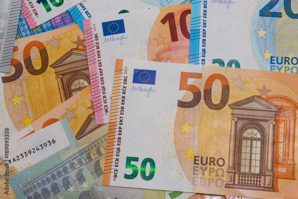 pile of paper euro banknotes as part of the united country's payment system