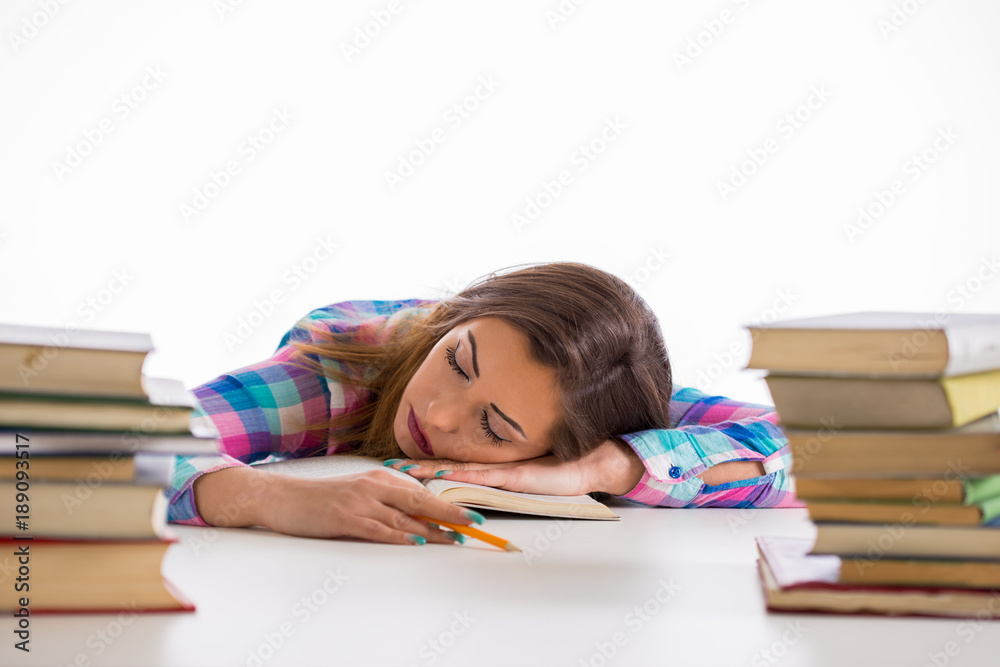 Beautiful young woman falling asleep while reading Beautiful young woman falling asleep while reading