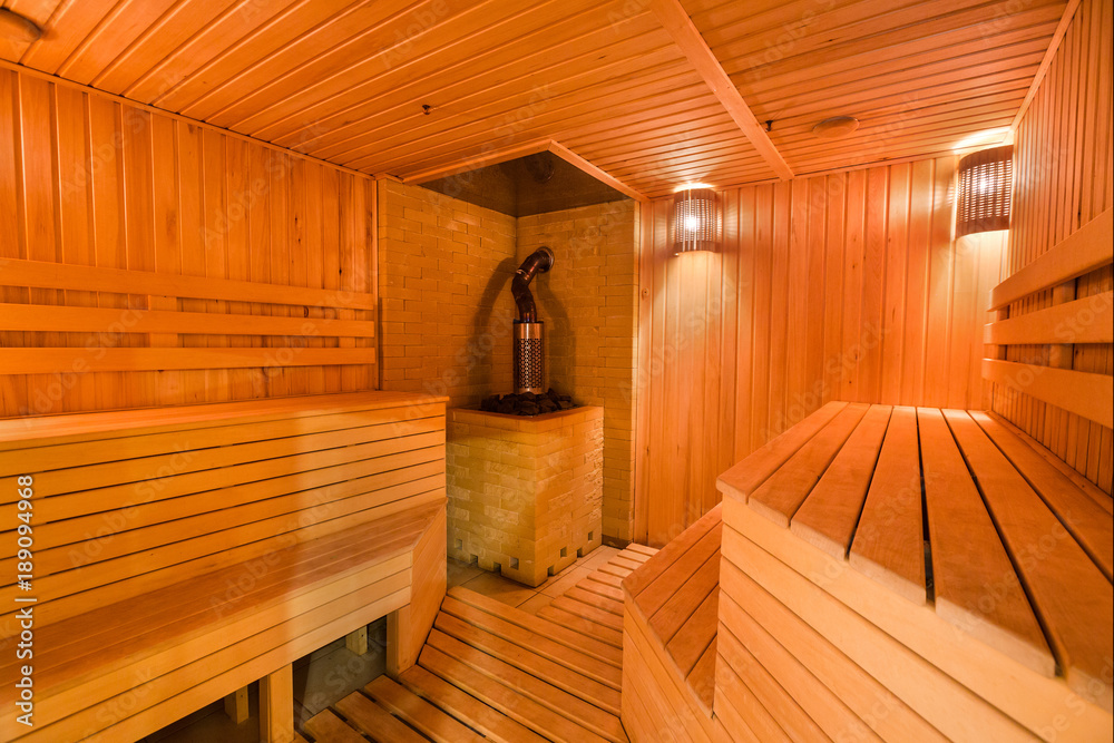 interior, spa procedure, beauty cincept, there is lovele decorated space for taking steam buth in comfort and having rest with friends on wooden benches interior, spa procedure, beauty cincept, there is lovele decorated space for taking steam buth in comfort and having rest with friends on wooden benches