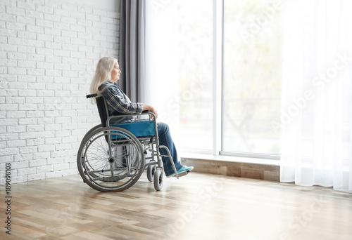 Mature woman in wheelchair ...